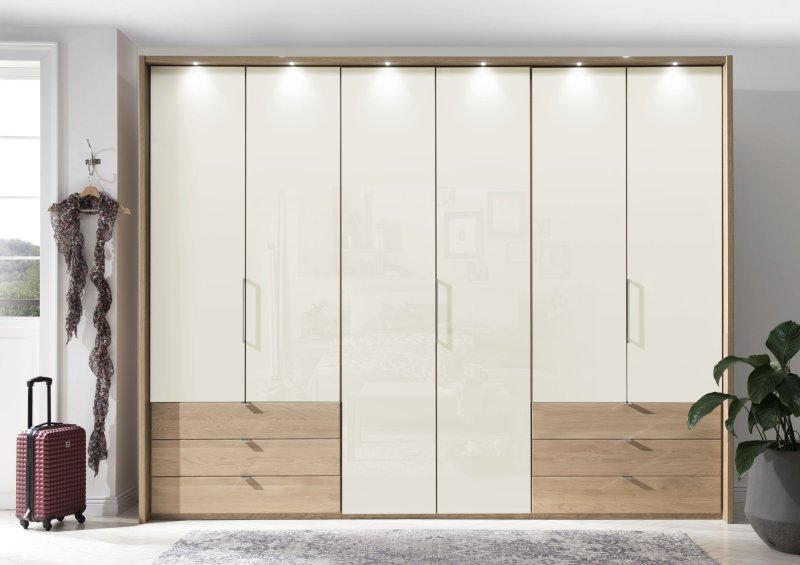 Wiemann Serena Plus 300 cm 6 Door 3 Drawer Left and Right Bi-Fold Panorama Wardrobe with Champagne Glass Front